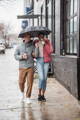 interacial-couple-walking-rain-umbrella