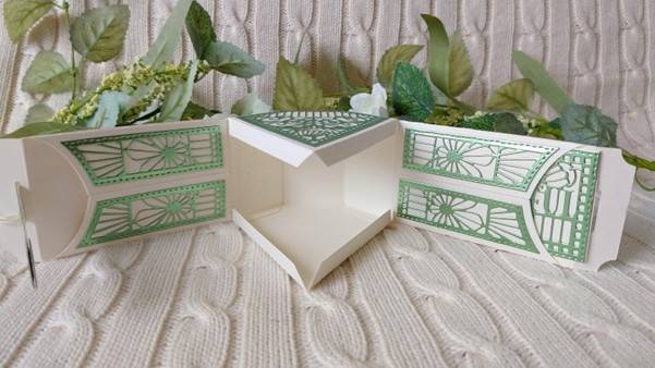 a box with green and white designs