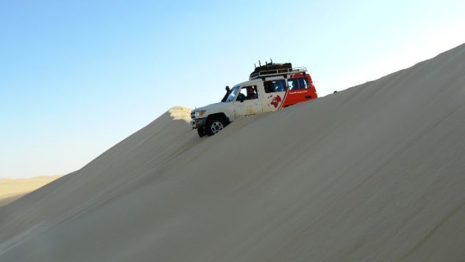 Riding over the dunes in Egypt's Western Desert