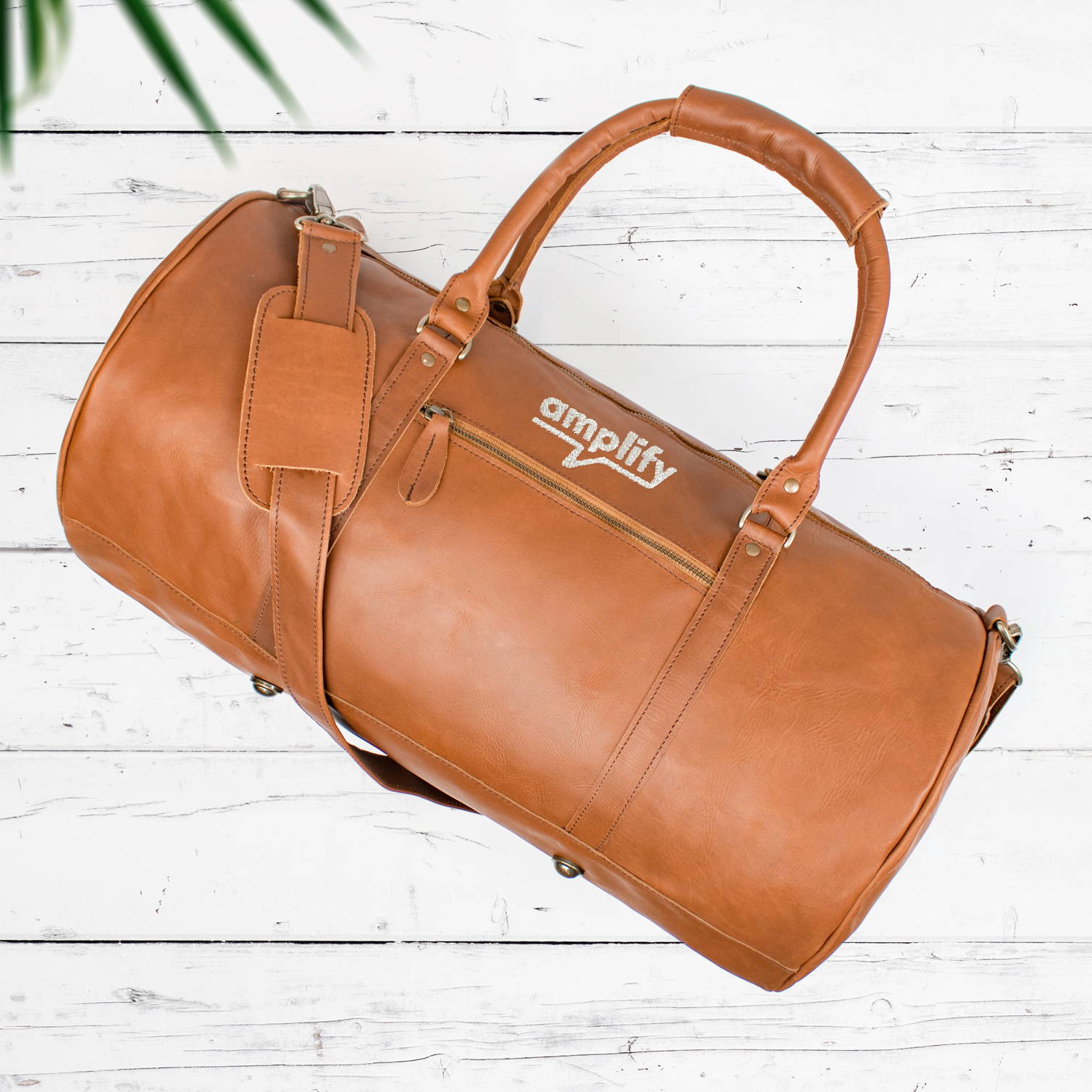 branded leather duffle bag