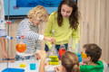 Kids using instruments on a chemistry class. 