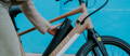 Rider removing battery from Aventon Pace electric bike