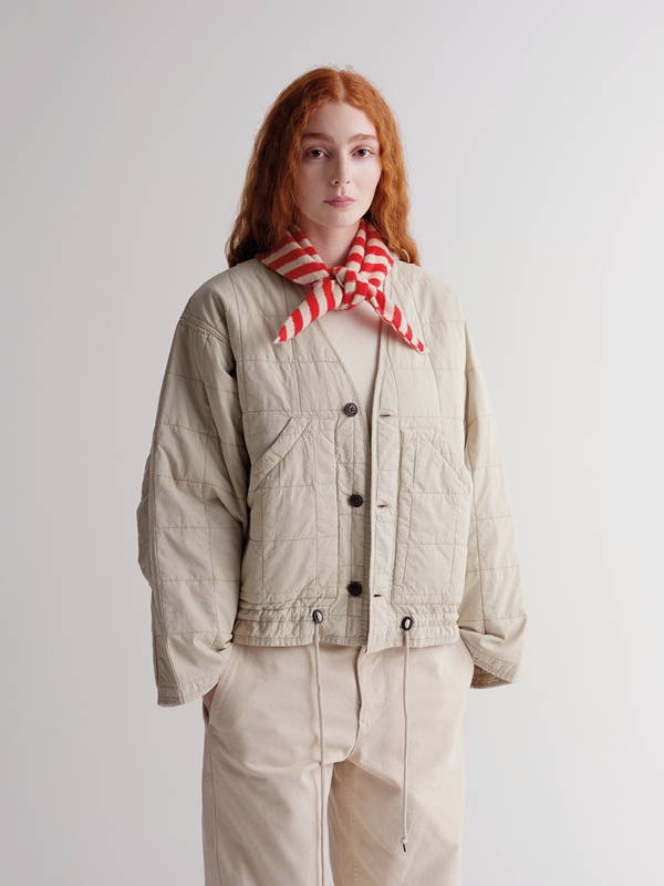 model wears stripe triangle neckerchief poppy and oatmeal
