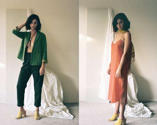 Woman wearing artisan made green deconstructed blazer with black high waisted cropped trousers and yellow slide on heeled sandals from sustainable womenswear brand Leo Strange and woman wearing red slip dress with yellow scarf and yellow heeled slip on sandals