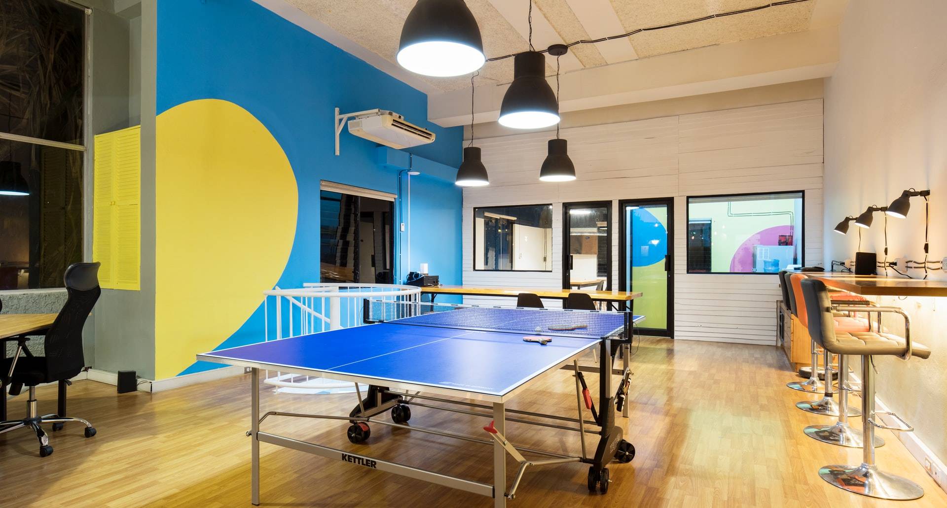 office start up space with a ping pong table in the middle
