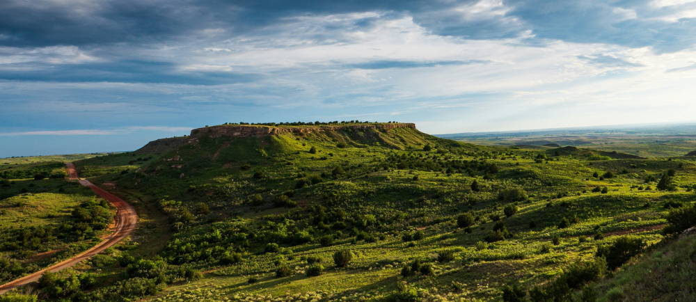 a mesa and dirt road in oklahoma