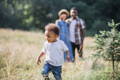 Mother, father and their son enjoying in the nature. 