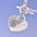 mums fingerprint engraved onto a heart shaped pendant, a perfect piece of jewellery to remind you of mum