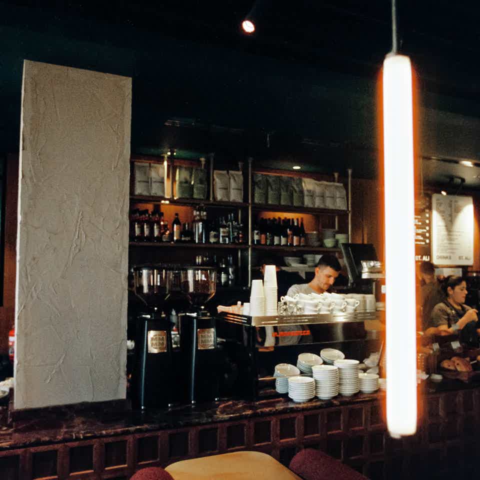 Cafe interior with aeroplane outside window at an airport