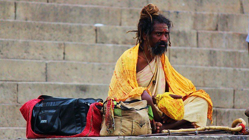 Indian holy man by the Ganges river, Varanasi, India 