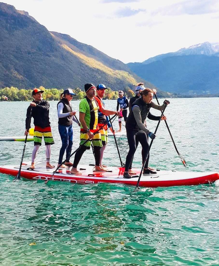 425pro board in action: multiple people are paddling in the sea