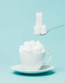 white tea cup filled with sugar cubes - avoid adding ingredients that are too high in sugar
