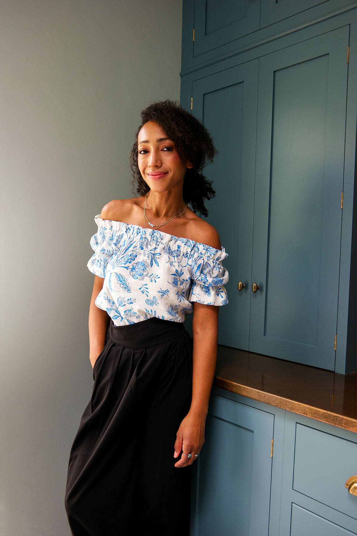 Nikki Tibbles wears Yolke's bluebird print Lila Blouse