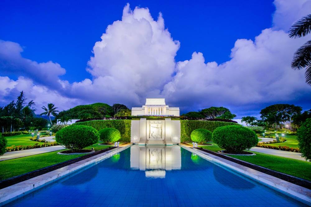 LDS art Laie Temple picture focusing on the blue of the reflection pool and the deep blue sky. 