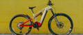 Cannondale Moterra Neo Carbon 2 electric mountain bike in front of yellow wall
