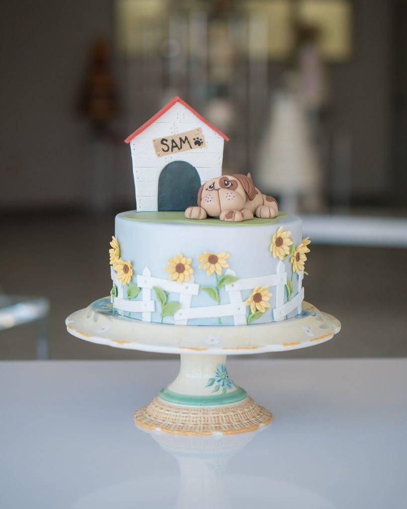 Cake with a dog, doghouse, and sunflowers on it. Perfect for birthdays or special occasions. Call to order yours today at House of Clarendon in Lancaster, PA