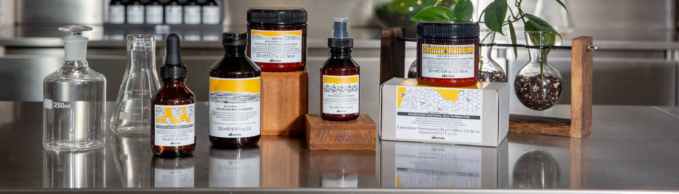 Davines Naturaltech NOURISHING products sitting on a lab table