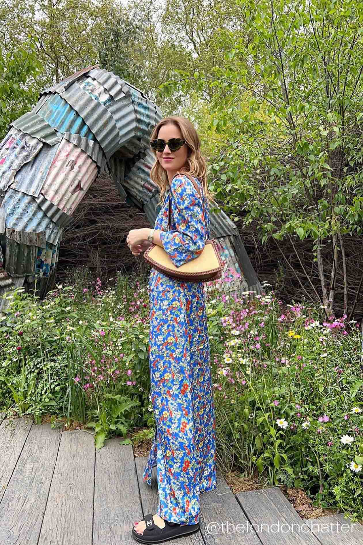 Influencer Kelly Eastwood wears the Yolke blue floral thea dress