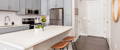 Kitchen with an island and stainless steel appliances at The Carter.