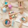 A 5-piece Montessori wooden Rattle Kit for babies. 
