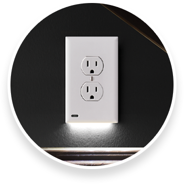  Single outlet light cover on a black wall
