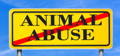 yellow sign that reads "animal abuse" crossed out with a red line