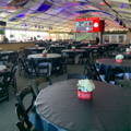 black vinyl tablecloths over several tables in an event
