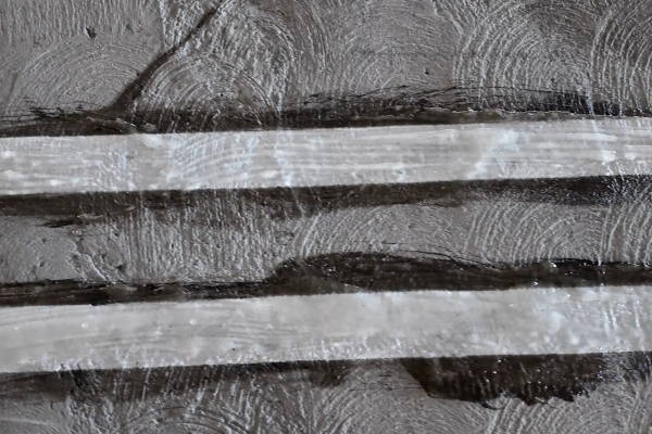 Graffiti removal from Stained Concrete Bike Path Grating