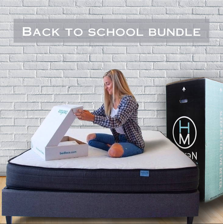 Couple sitting up in bed on a haven sleep co adjustable bed frame
