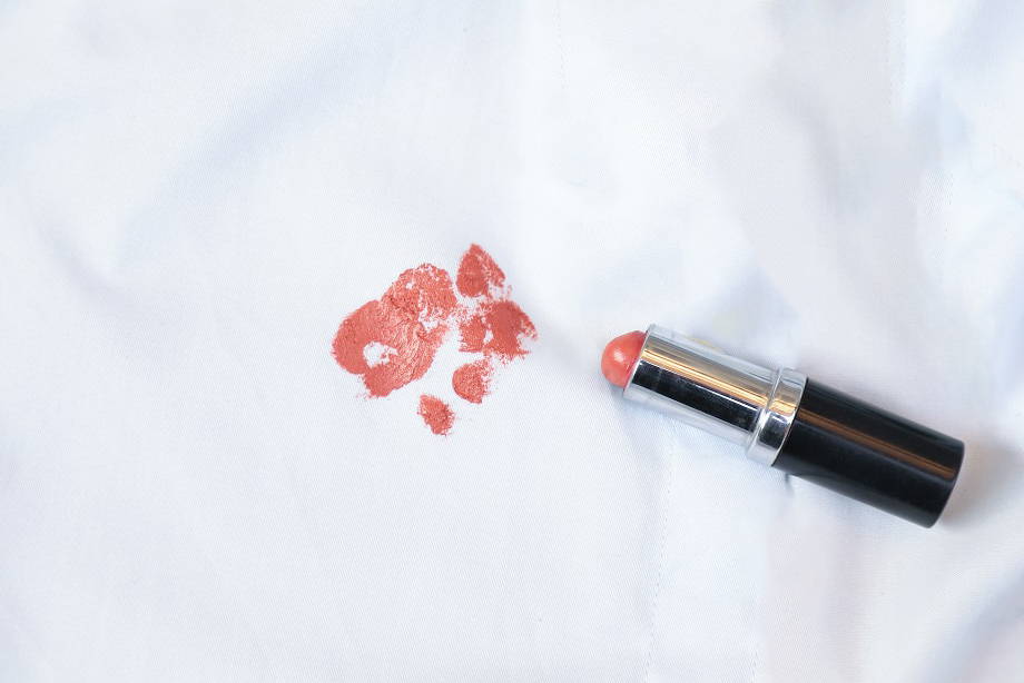 lipstick laying next to a lipstick stained cloth