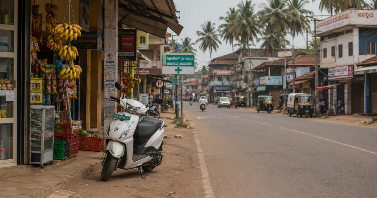 Electric scooter parked on a street in a Coastal Karnataka town