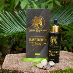 Mane Growth Elixir on moss with fresh leaves
