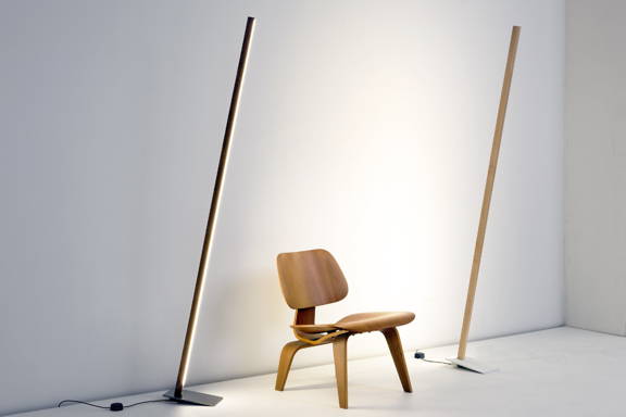 Two Stickbulb Floor Torches lighting a wooden chair