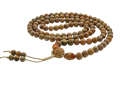 woman counting mala beads