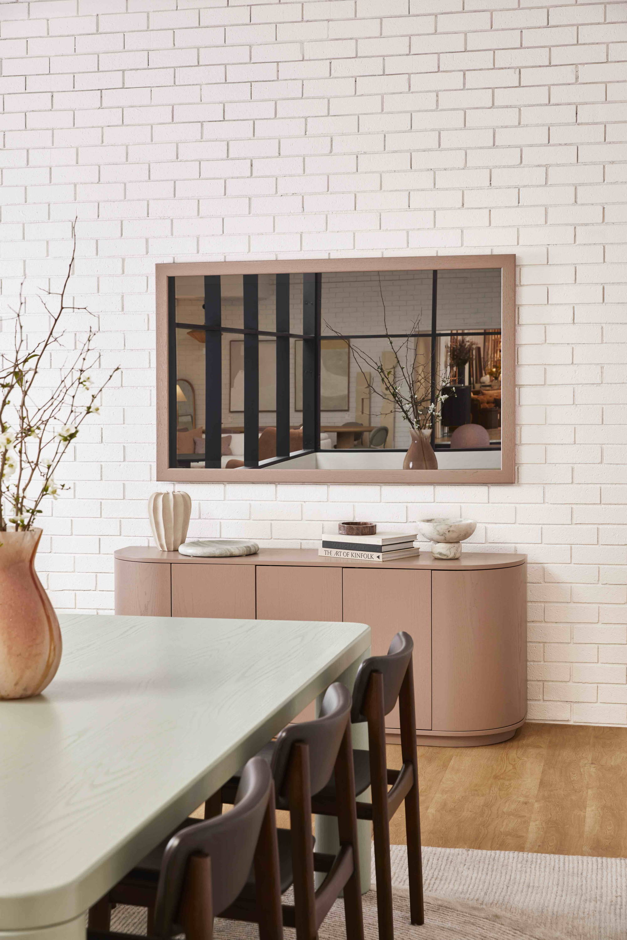 Custom Pink Frame TV-Mirror by FRAMING TO A T - A pink TV-Mirror frame in a living room setting.
