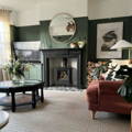 farrow and ball green smoke paint in a living room with botanical elements and anatural interior design.