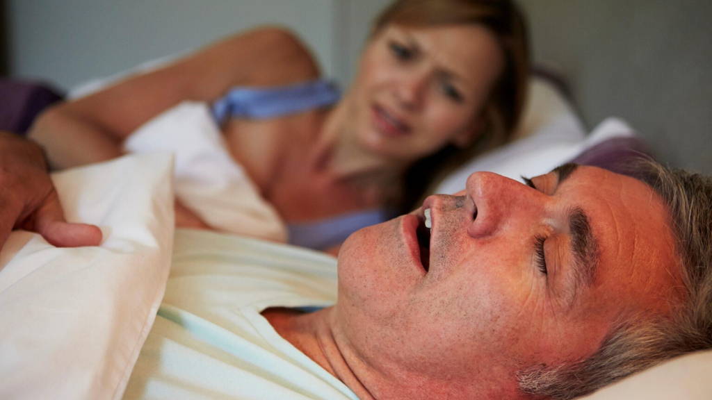 Man Keeping Woman Awake In Bed With Snoring