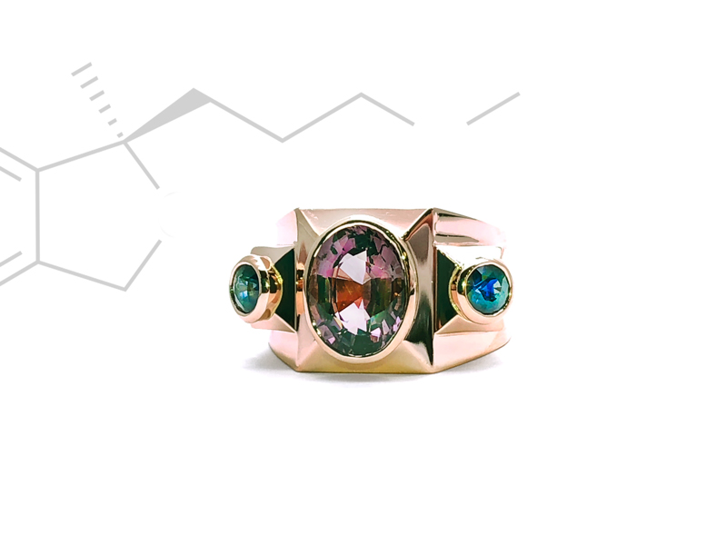 Multi-faceted structural ring in pink gold with sapphire stones in closed setting