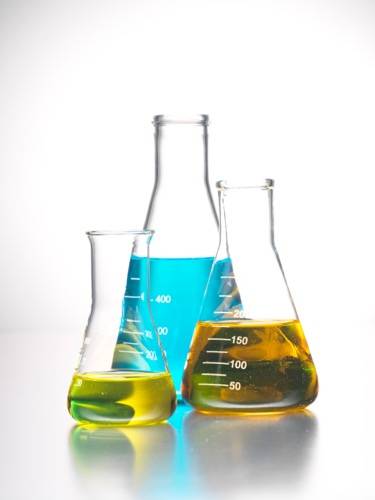 Erlenmeyer flasks filled with colored liquid