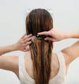 Combing wet hair blow dry straight