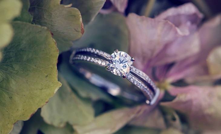 1.5 Carat Round Brilliant Cut GIA Diamond With Split Diamond-Set Shoulders & Emerald Cut Detailing Bespoke diamond engagement rings - Pobjoy Diamonds