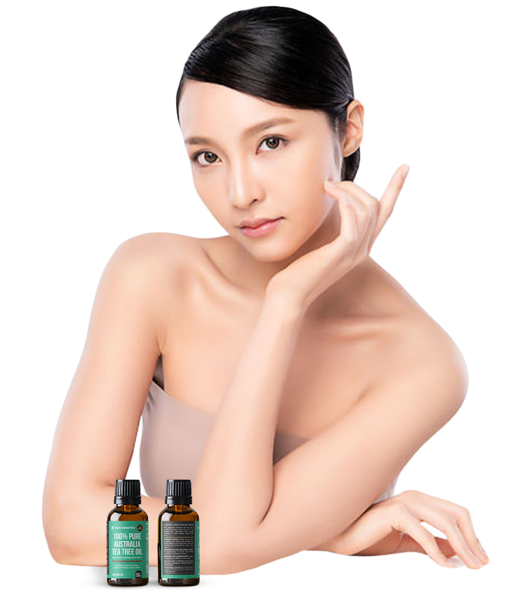 Beautiful lady showing tea tree oil uses