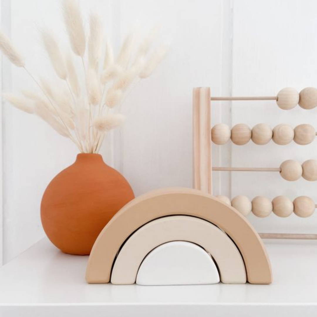 Neutral wooden toys with pop of colour for nursery decor 