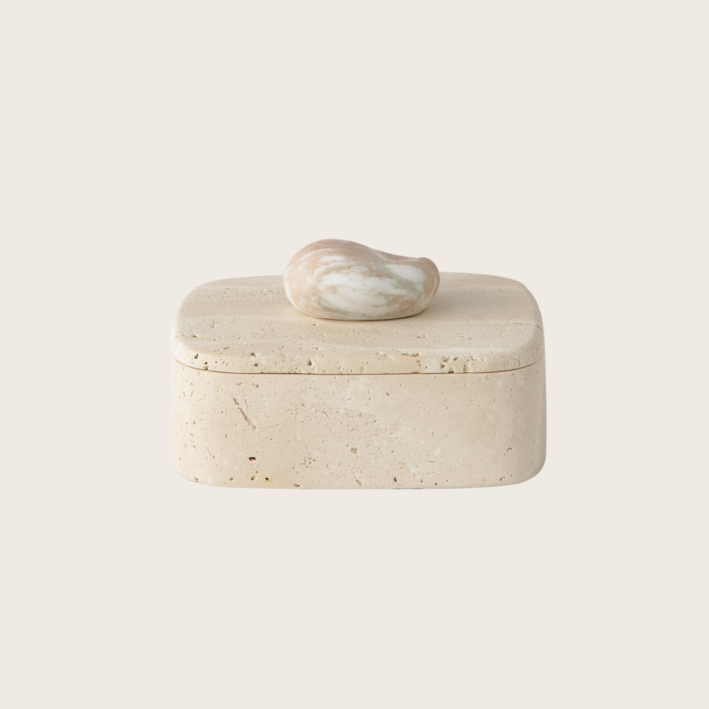 Pietra Box Travertine Rose by Framing To a t – A rectangular box made from pink travertine with a smooth finish and natural stone detail.