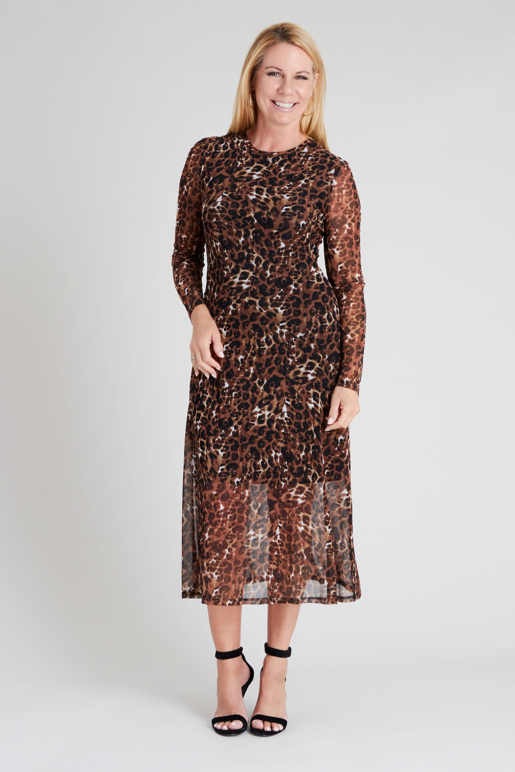 woman posing in brown and black cheetah type animal print mesh long sleeve ankle-length connected apparel dress