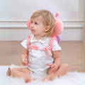 Baby girl wearing her protective backpack called Montessori Baby Guardian.