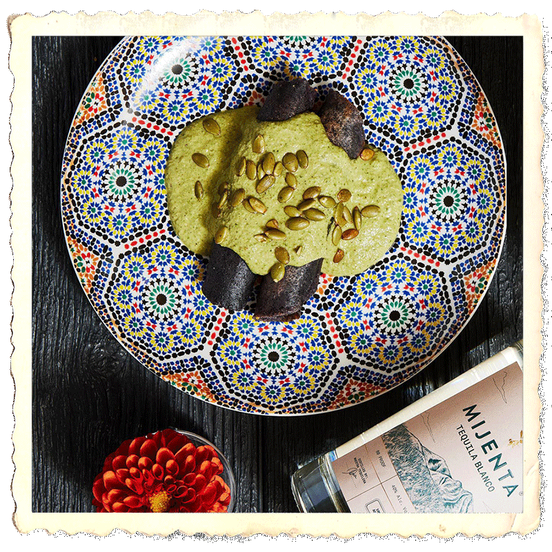 Prepared plate calabaza, sided by flowers and a mexican calavera stylized cup.