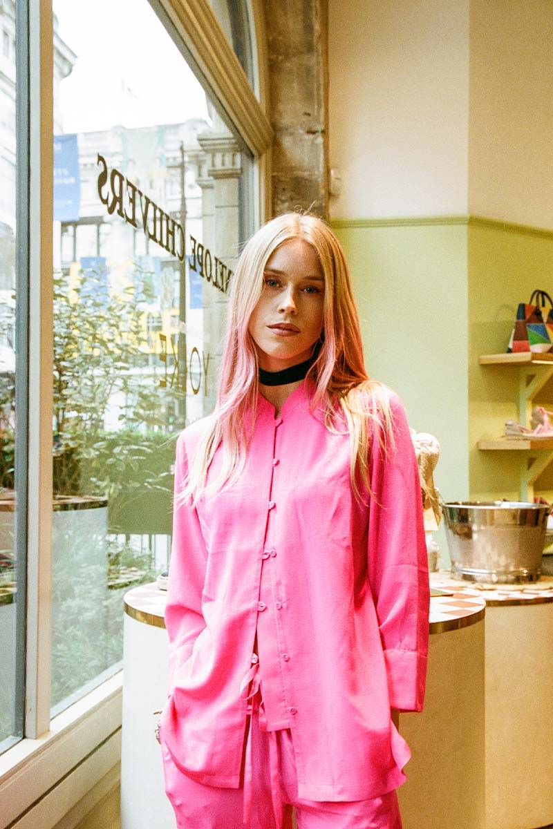 Lady Mary Charteris at YOLKE x Penelope Chilvers Launch party wearing YOLKE's hot pink Mandarine Suit