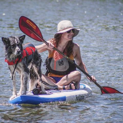 Inflatable paddleboarding with dogs in Canada lake