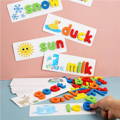 Man completing a spelling card by placing a letter on it while examples of different spelling cards are shown in the back. 